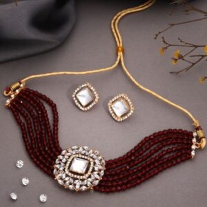 Glamorous gold choker ensemble showcasing beads